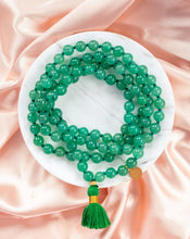 Ladda upp bild till gallerivisning, Elegant and exclusive mala necklace with Green Aventurine crystals and details in 18k gold-plated 925 sterling silver and brass. Presented on marble and pink silk.